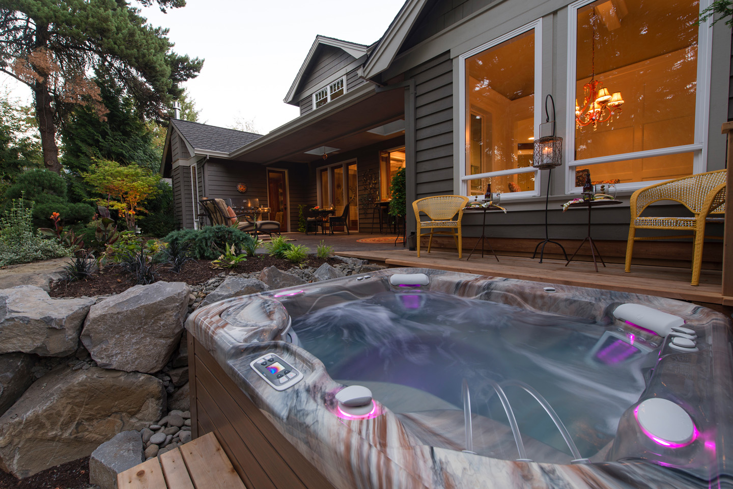 Backyard hot tub filled and lit at a Denver home