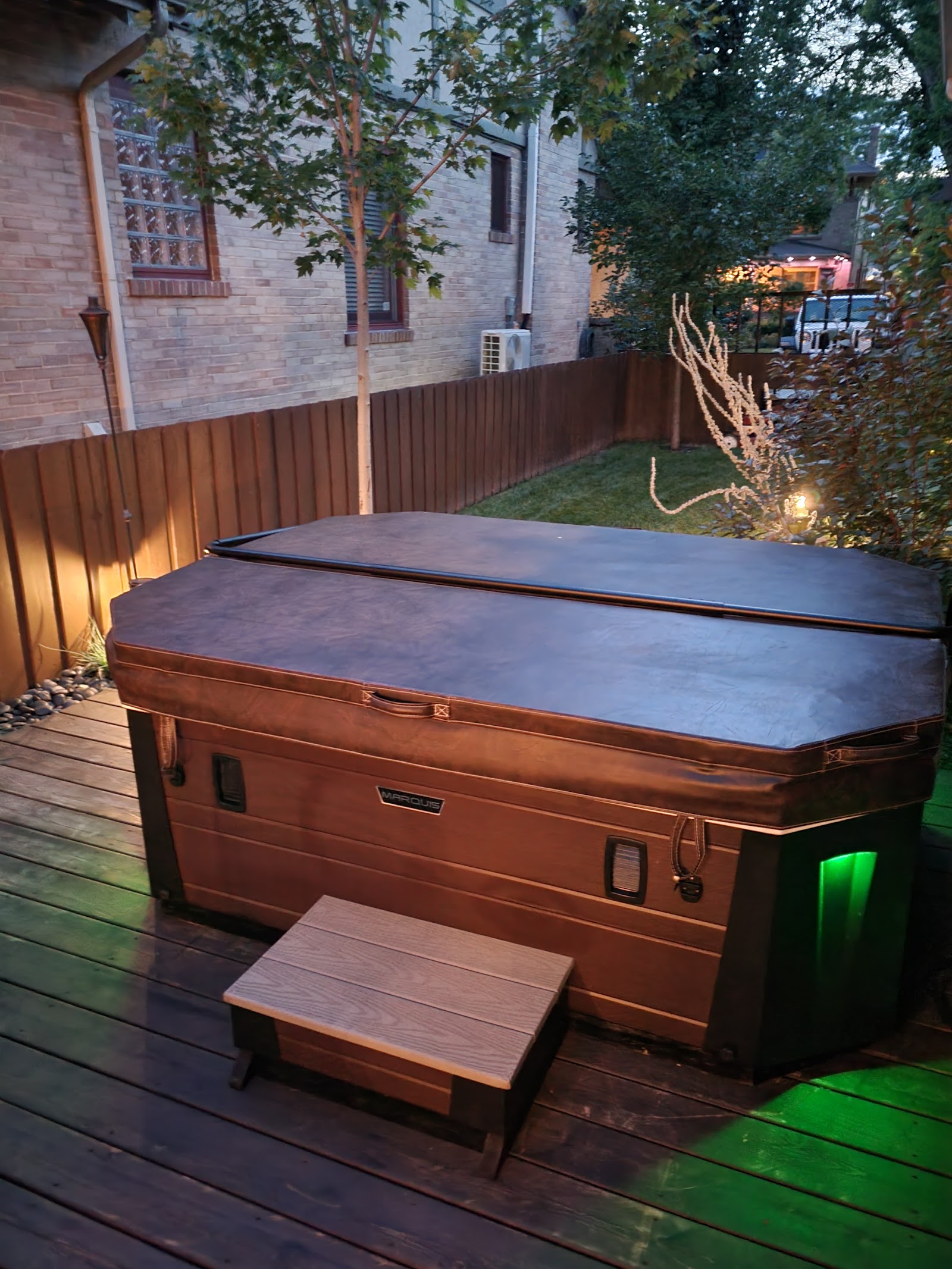 Covered backyard hot tub ready for seasonal care
